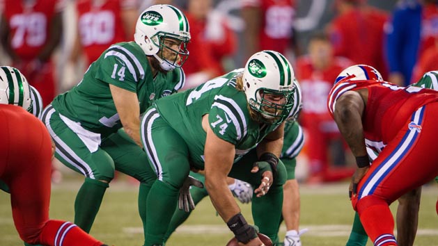 Nick Mangold (74) hikes the ball to New York Jets quarterback Ryan Fitzpatrick (14) in the 2nd half against the Buffalo Bills at MetLife Stadium last season. The Bills defeated the Jets 22-17 Photo Credit: William Hauser-USA TODAY Sports