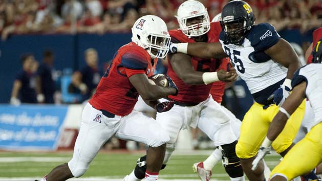Sep 19, 2015; Tucson, AZ, USA; Arizona Wildcats running back Nick Wilson (28) runs the ball during the second quarter against the Northern Arizona Lumberjacks at Arizona Stadium. Mandatory Credit: Casey Sapio-USA TODAY Sports