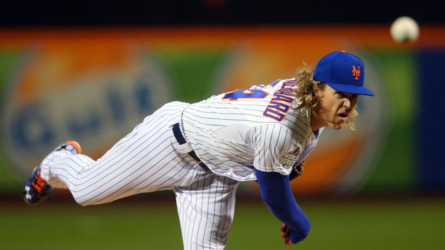 Oct 30, 2015; New York City, NY, USA; New York Mets starting pitcher Noah Syndergaard throws a pitch against the Kansas City Royals in the first inning in game three of the World Series at Citi Field. Mandatory Credit: Brad Penner-USA TODAY Sports