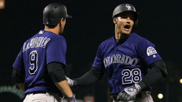 Jul 5, 2016; San Francisco, CA, USA; Colorado Rockies third baseman Nolan Arenado (28) right is greeted at home plate by second baseman D.J. LeMahieu (9) after Arenado three run homer in the seventh inning of their MLB baseball game with the San Francisco Giants at AT&T Park. Photo Credit: Lance Iversen-USA TODAY Sports