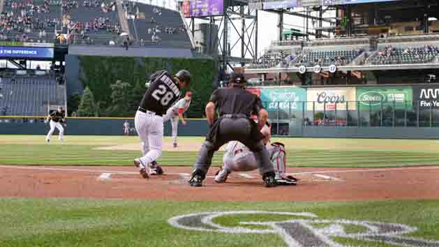 May 31, 2016; Denver, CO, USA; Colorado Rockies third baseman Nolan Arenado (28) hits a two run home run in the first inning against the Cincinnati Reds at Coors Field. Photo Credit: Isaiah J. Downing-USA TODAY Sports