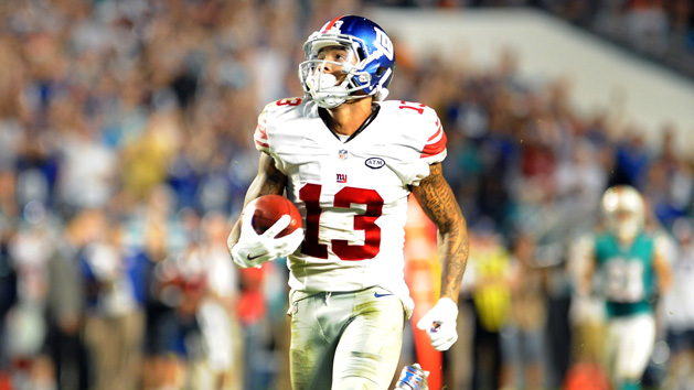 Dec 14, 2015; Miami Gardens, FL, USA; New York Giants wide reciever Odell Beckham Jr (13) runs untouched into the endzone for a Giants touchdown in the fourth quarter against the Miami Dolphins at Sun Life Stadium. Mandatory Credit: Robert Duyos-USA TODAY Sports