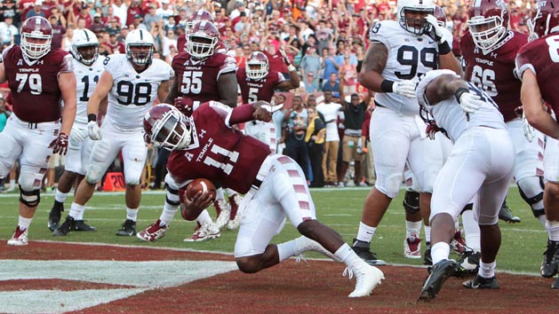 Sep 5, 2015; Philadelphia, PA, USA; Temple Owls quarterback P.J. Walker (11) runs the ball into the end zone for a touchdown during the third quarter against the Penn State Nittany Lions at Lincoln Financial Field. Temple defeated Penn State 27-10. Mandatory Credit: Matthew O'Haren-USA TODAY Sports