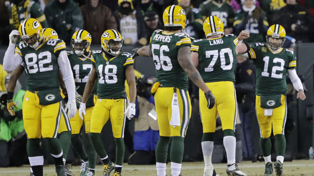 Jan 8, 2017; Green Bay, WI, USA; Green Bay Packers quarterback Aaron Rodgers (12) celebrates with teammates after throwing a touchdown pass against the New York Giants in the second quarter in the NFC Wild Card playoff football game at Lambeau Field. Photo Credit: Dan Powers/The Post-Crescent via USA TODAY Sports