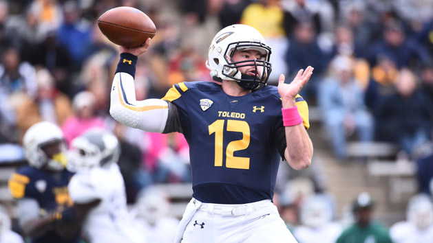 Oct 17, 2015; Toledo, OH, USA; Toledo Rockets quarterback Phillip Ely (12) drops back to pass during the first quarter against the Eastern Michigan Eagles at Glass Bowl. Mandatory Credit: Tim Fuller-USA TODAY Sports