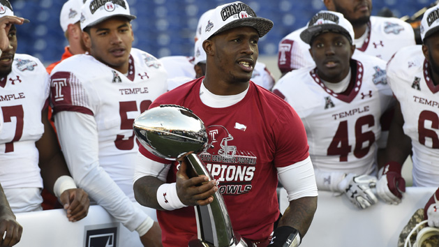Dec 3, 2016; Annapolis, MD, USA; Temple Owls quarterback Phillip Walker (8) holds American Athletic Conference football trophy during a post game celebration after defeating Navy Midshipmen 34-10 at Navy-Marine Corps Memorial Stadium. Photo Credit: Tommy Gilligan-USA TODAY Sports