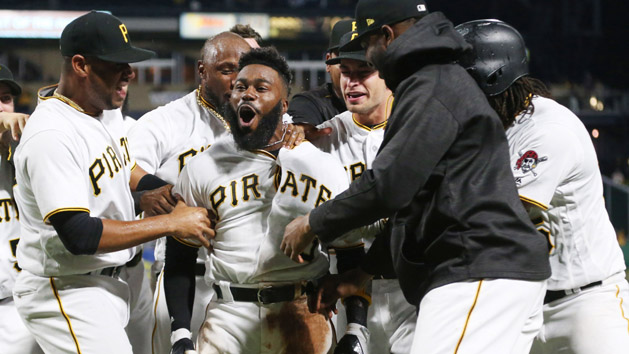Aug 23, 2017; Pittsburgh, PA, USA; Pittsburgh Pirates second baseman Josh Harrison (middle) celebrates with teammates after hitting a walk-off home run against the Los Angeles Dodgers during the tenth inning at PNC Park. Harrison's home run was the first Pirate hit of the game off Los Angeles Dodgers pitcher Rich Hill (not Pictured). Photo Credit: Charles LeClaire-USA TODAY Sports