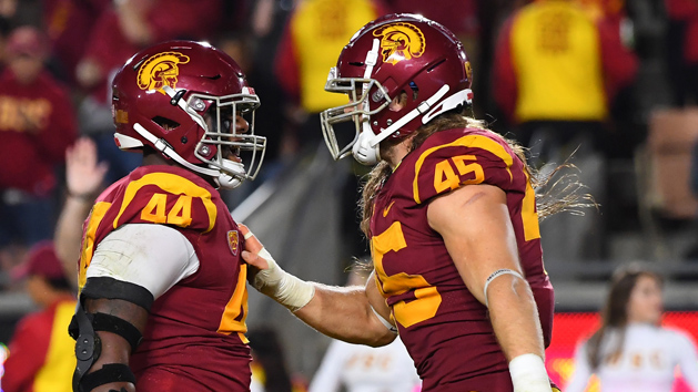Oct 13, 2018; Los Angeles, CA, USA; USC Trojans defensive lineman Malik Dorton (44) and linebacker Porter Gustin (45) celebrate after sacking Colorado Buffaloes quarterback Steven Montez (not pictured) in the third quarter at the Los Angeles Memorial Coliseum. Photo Credit: Jayne Kamin-Oncea-USA TODAY Sports