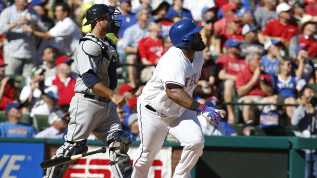 Apr 4, 2016; Arlington, TX, USA; Texas Rangers designated hitter Prince Fielder (84) drives in a run with a single in the fifth inning against the Seattle Mariners at Globe Life Park in Arlington. Mandatory Credit: Tim Heitman-USA TODAY Sports
