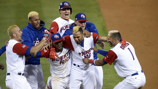 March 20, 2017; Los Angeles, CA, USA; Puerto Rico third baseman Carlos Correa (1) and right fielder Eddie Rosario (17) celebrate the 4-3 extra innings victory against Netherlands during the 2017 World Baseball Classic at Dodger Stadium. Photo Credit: Gary A. Vasquez-USA TODAY Sports