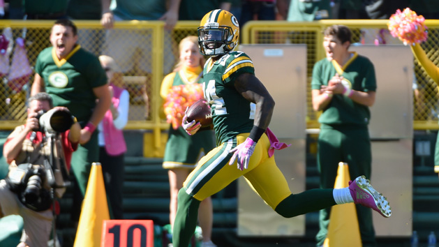 Oct 11, 2015; Green Bay, WI, USA; Green Bay Packers cornerback Quinten Rollins (24) returns an interception for a touchdown in the first quarter against the St. Louis Rams at Lambeau Field. Mandatory Credit: Benny Sieu-USA TODAY Sports