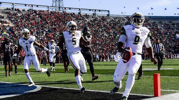Dec 29, 2016; Birmingham, AL, USA; South Florida Bulls quarterback Quinton Flowers (9) scores a touchdown during the first quarter against the South Carolina Gamecocks in the 2016 Birmingham Bowl at Legion Field. Photo Credit: Shanna Lockwood-USA TODAY Sports