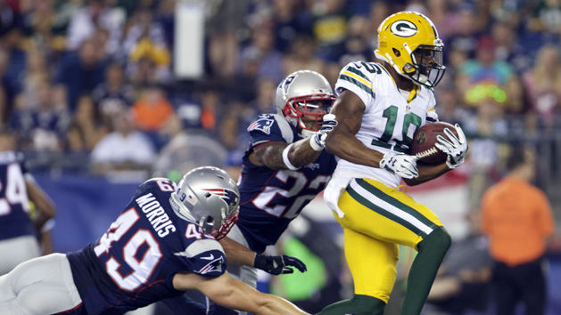 Randall Cobb (18) runs the ball against New England Patriots linebacker James Morris (49) and corner back Robert McClain (22) during the first half in a preseason NFL football game at Gillette Stadium. David Butler II-USA TODAY) Sports