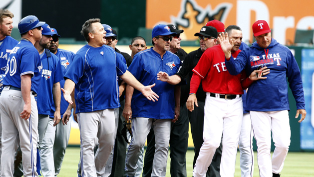May 15, 2016; Arlington, TX, USA; Toronto Blue Jays manager John Gibbons (5) yells at Texas Rangers manager Jeff Banister (28) after the benches cleared in the eighth inning at Globe Life Park in Arlington. Texas won 7-6. Photo Credit: Tim Heitman-USA TODAY Sports