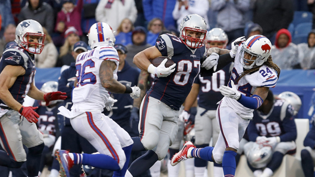 Oct 30, 2016; Orchard Park, NY, USA; Buffalo Bills cornerback Stephon Gilmore (24) tries to tackle New England Patriots tight end Rob Gronkowski (87) after a catch during the second half at New Era Field. The Patriots beat the Bills 41-25. Photo Credit: Timothy T. Ludwig-USA TODAY Sports