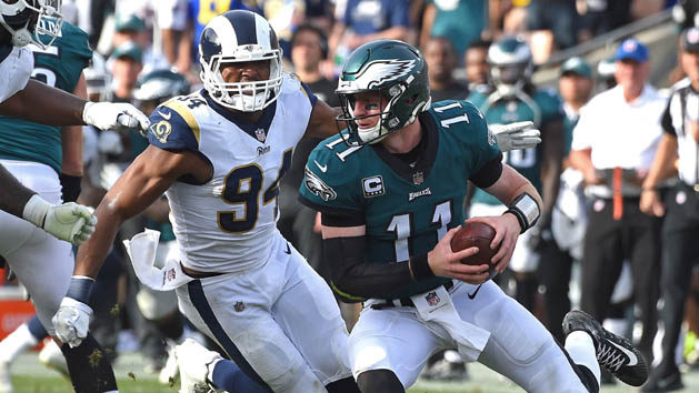 Dec 10, 2017; Los Angeles, CA, USA; Philadelphia Eagles quarterback Carson Wentz (11) is pressured by Los Angeles Rams outside linebacker Robert Quinn (94) ending up in a sack in the first half of the game at the Los Angeles Memorial Coliseum. Photo Credit: Jayne Kamin-Oncea-USA TODAY Sports