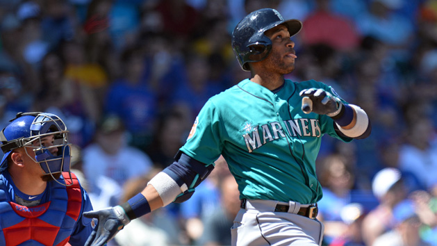 Mar 27, 2016; Mesa, AZ, USA; Seattle Mariners second baseman Robinson Cano (22) hits a two run home run during the first inning against the Chicago Cubs at Sloan Park. Mandatory Credit: Jake Roth-USA TODAY Sports