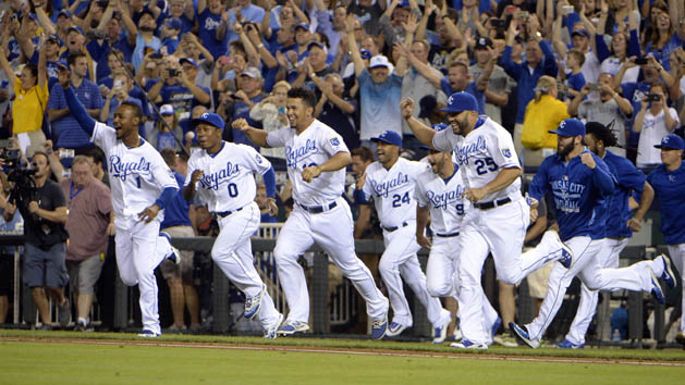 Sep 24, 2015; Kansas City, MO, USA; Kansas City Royals players celebrate after the game against the Seattle Mariners at Kauffman Stadium. Kansas City won the game 10-4 and won the American League central division. Mandatory Credit: John Rieger-USA TODAY Sports