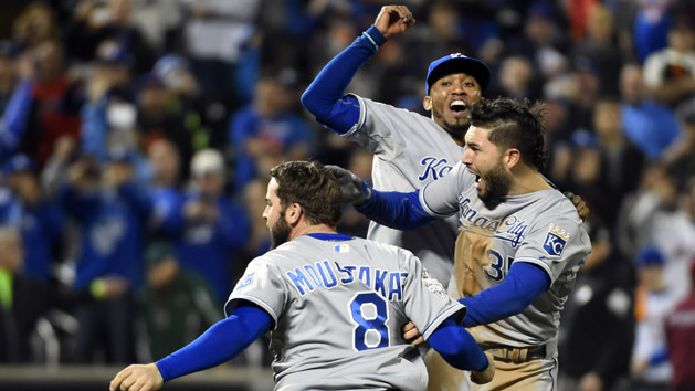 Nov 1, 2015; New York City, NY, USA; Kansas City Royals players Mike Moustakas (8) , Eric Hosmer (35) and Alcides Escobar (2) celebrate after defeating the New York Mets in game five of the World Series at Citi Field. The Royals won the World Series four games to one. Mandatory Credit: Robert Deutsch-USA TODAY Sports