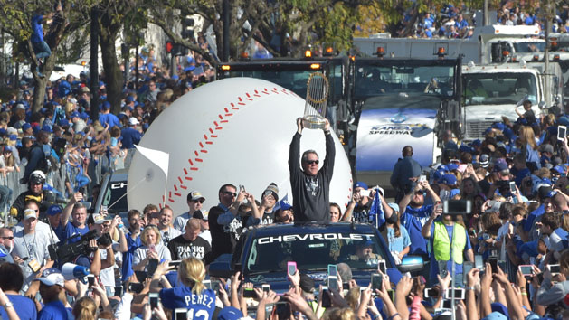 Nov 3, 2015; Kansas City, MO, USA; Kansas City Royals manager Ned Yost (3) holds the Commissioners Trophy up to fans during the World Series parade route at Union Station. Mandatory Credit: Denny Medley-USA TODAY Sports