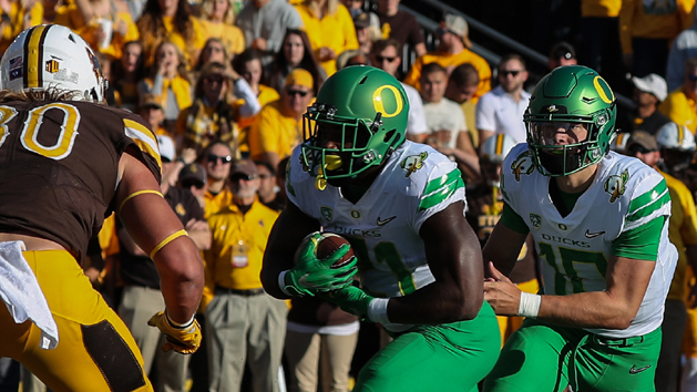 Sep 16, 2017; Laramie, WY, USA; Oregon Ducks running back Royce Freeman (21) scores a touchdown against the Wyoming Cowboys during the first quarter at War Memorial Stadium. Photo Credit: Troy Babbitt-USA TODAY Sports