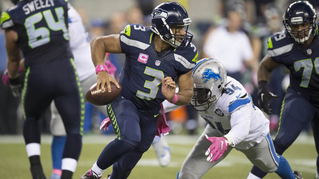 Oct 5, 2015; Seattle, WA, USA; Seattle Seahawks quarterback Russell Wilson (3) runs away from Detroit Lions defensive end Ezekiel Ansah (94) during the third quarter at CenturyLink Field. The Seahawks won 13-10. Photo Credit: Troy Wayrynen-USA TODAY Sports