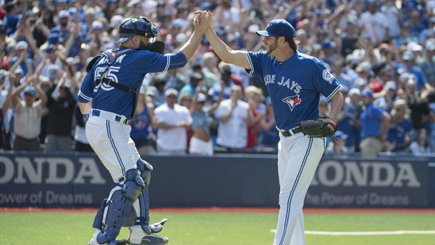 Jun 12, 2016; Toronto, Ontario, CAN; Toronto Blue Jays relief pitcher Jason Grilli (37) celebrates with catcher Russell Martin (55) after defeating the Baltimore Orioles 10-9 at Rogers Centre. Photo Credit: Nick Turchiaro-USA TODAY Sports