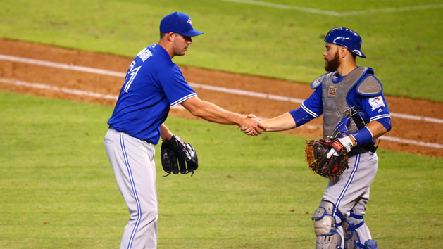 Jul 20, 2016; Phoenix, AZ, USA; Toronto Blue Jays pitcher Joe Biagini (left) celebrates with catcher Russell Martin after defeating the Arizona Diamondbacks at Chase Field. Mandatory Credit: Mark J. Rebilas-USA TODAY Sports