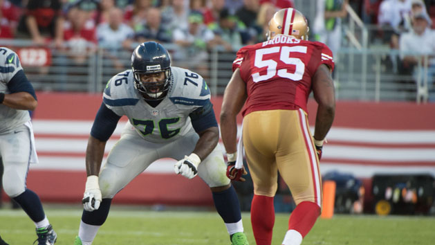 October 22, 2015; Santa Clara, CA, USA; Seattle Seahawks tackle Russell Okung (76) blocks San Francisco 49ers outside linebacker Ahmad Brooks (55) during the first quarter at Levi's Stadium. The Seahawks defeated the 49ers 20-3. Mandatory Credit: Kyle Terada-USA TODAY Sports