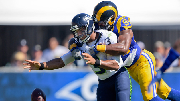 Sep 18, 2016; Los Angeles, CA, USA; Seattle Seahawks quarterback Russell Wilson (3) looses the ball as he is sacked by Los Angeles Rams defensive end Robert Quinn (94) during the first half of a NFL game against the Seattle Seahawks at Los Angeles Memorial Coliseum. Photo Credit: Kirby Lee-USA TODAY Sports