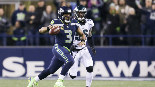 Dec 3, 2017; Seattle, WA, USA; Seattle Seahawks quarterback Russell Wilson (3) scrambles against Philadelphia Eagles defensive end Chris Long (56) during the second quarter at CenturyLink Field. Photo Credit: Joe Nicholson-USA TODAY Sports