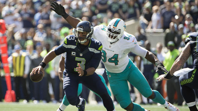 Sep 11, 2016; Seattle, WA, USA; Seattle Seahawks quarterback Russell Wilson (3) is sacked by Miami Dolphins defensive end Mario Williams (94) during the first quarter at CenturyLink Field. Photo Credit: Troy Wayrynen-USA TODAY Sports