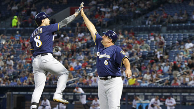 May 26, 2016; Atlanta, GA, USA; Milwaukee Brewers left fielder Ryan Braun (8) is congratulated by third base coach Ed Sedar (6) after a home run against the Atlanta Braves in the fifth inning at Turner Field. Photo Credit: Brett Davis-USA TODAY Sports