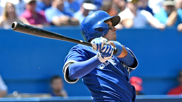 Aug 13, 2015; Toronto, Ontario, CAN; Toronto Blue Jays shortstop Ryan Goins (17) hits a three-run home run against Oakland Athletics in the second inning at Rogers Centre. Mandatory Credit: Dan Hamilton-USA TODAY Sports
