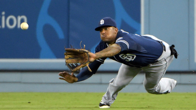 Sep 9,2014; Los Angeles, CA, USA; San Diego Padres right fielder Rymer Liriano (7) attempts to catch a fly ball by Los Angeles Dodgers left fielder Carl Crawford (not pictured) in the fourth inning at Dodger Stadium. Mandatory Credit: Kirby Lee-USA TODAY Sports