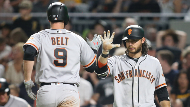 Jun 30, 2017; Pittsburgh, PA, USA; San Francisco Giants first baseman Brandon Belt (9) crosses home plate on a solo home run as shortstop Brandon Crawford (35) gives a high five against the Pittsburgh Pirates during the eighth inning at PNC Park. Photo Credit: Charles LeClaire-USA TODAY Sports