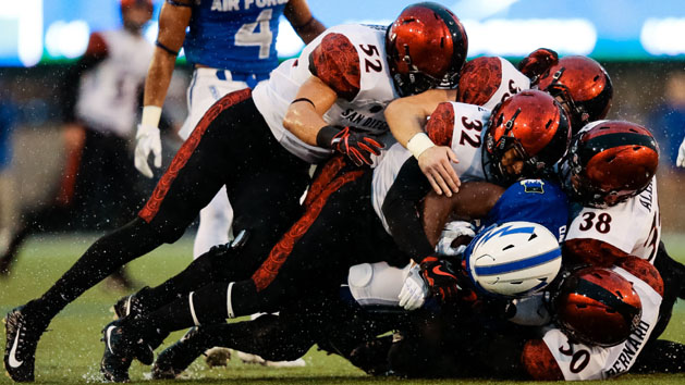 Sep 23, 2017; Colorado Springs, CO, USA; Air Force Falcons wide receiver Ronald Cleveland (3) is tackled by San Diego State Aztecs cornerback Garrett Binkley (30) and linebacker Andrew Aleki (38) and safety Parker Baldwin (33) and linebacker Tyler Morris (52) in the first quarter at Falcon Stadium. Photo Credit: Isaiah J. Downing-USA TODAY Sports