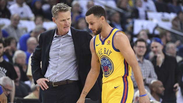March 8, 2018; Oakland, CA, USA; Golden State Warriors head coach Steve Kerr (left) talks to guard Stephen Curry (30) after an injury against the San Antonio Spurs during the first quarter at Oracle Arena. Photo Credit: Kyle Terada-USA TODAY Sports