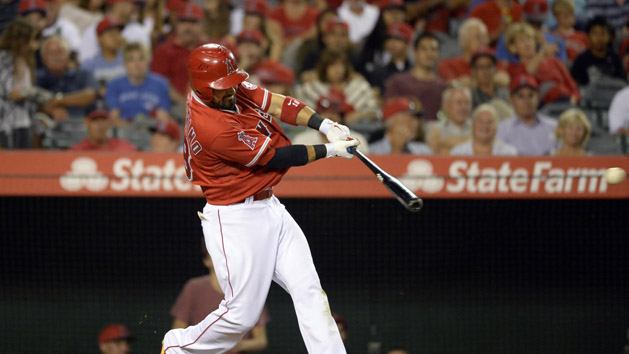 Aug 21, 2015; Anaheim, CA, USA; Los Angeles Angels right fielder Shane Victorino (18) hits a single against the Toronto Blue Jays during the sixth inning at Angel Stadium of Anaheim. Mandatory Credit: Richard Mackson-USA TODAY Sports