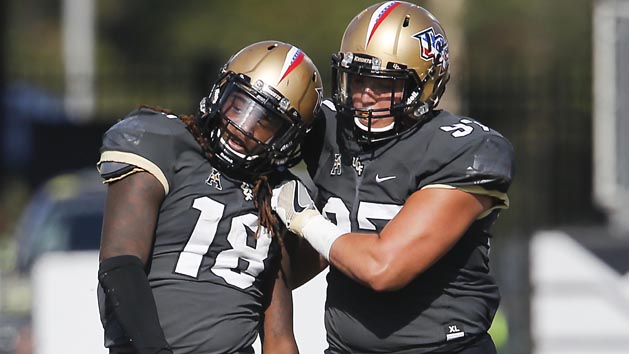 Nov 12, 2016; Orlando, FL, USA; UCF Knights defensive lineman Jock Petree (97) congratulates linebacker Shaquem Griffin (18) on his third sack of the game during the second half of a football game against the Cincinnati Bearcats at Bright House Networks Stadium. UCF won 24-3 and with the win become bowl eligible. Photo Credit: Reinhold Matay-USA TODAY Sports