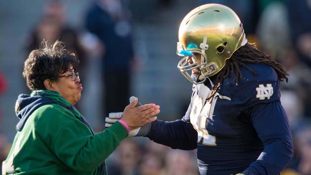Nov 14, 2015; South Bend, IN, USA; Notre Dame Fighting Irish defensive lineman Sheldon Day (91) greets his mother Carol Boyd during the Senior Day recognition ceremony before the game against the Wake Forest Demon Deacons at Notre Dame Stadium. Mandatory Credit: Matt Cashore-USA TODAY Sports