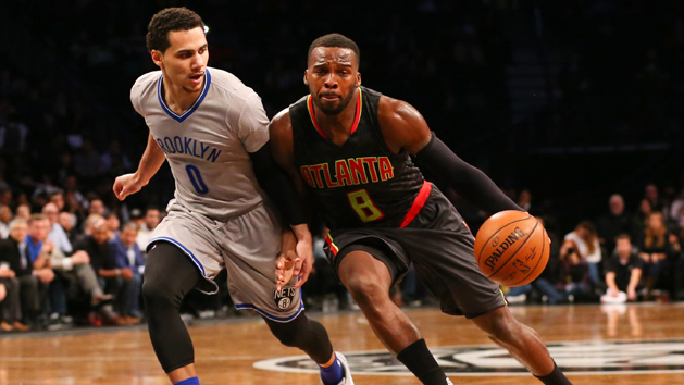 Nov 17, 2015; Brooklyn, NY, USA; Atlanta Hawks guard Shelvin Mack (8) dribbles the ball as Brooklyn Nets guard Shane Larkin (0) defends during the fourth quarter at Barclays Center. The Nets won 90-88. Photo Credit: Anthony Gruppuso-USA TODAY Sports