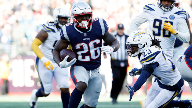 Jan 13, 2019; Foxborough, MA, USA; New England Patriots running back Sony Michel (26) rushes against Los Angeles Chargers defensive back Rayshawn Jenkins (23) during the second quarter in an AFC Divisional playoff football game at Gillette Stadium. Photo Credit: David Butler II-USA TODAY Sports