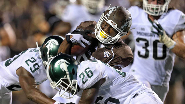 Sep 4, 2015; Kalamazoo, MI, USA; Western Michigan Broncos wide receiver Daniel Braverman (8) is tacked by Michigan State Spartans safety Rj Williamson (26) during the 1st half of a game at Waldo Stadium. Mandatory Credit: Mike Carter-USA TODAY Sports