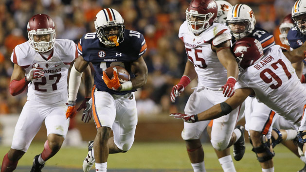 Oct 22, 2016; Auburn, AL, USA; Auburn Tigers running back Stanton Truitt (10) gets past Arkansas Razorback defenders and scores a touchdown during the fourth quarter at Jordan Hare Stadium. The Tigers beat the Razorbacks 56-3. Photo Credit: John Reed-USA TODAY Sports