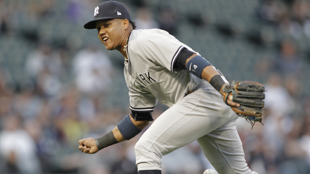 Jun 26, 2017; Chicago, IL, USA; New York Yankees second baseman Starlin Castro (14) miss judges a ground ball during the first inning against the Chicago White Sox at Guaranteed Rate Field. Photo Credit: Caylor Arnold-USA TODAY Sports