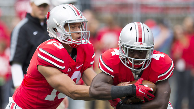 Stephen Collier (13) hands the ball off to running back Curtis Samuel (4) during warmups before the game against the Kent State Golden Flashes at Ohio Stadium in 2014. Photo Credit: Greg Bartram-USA TODAY Sports