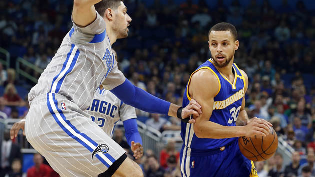 Jan 22, 2017; Orlando, FL, USA; Golden State Warriors guard Stephen Curry (30) moves to the basket s Orlando Magic center Nikola Vucevic (9) defends during the first quarter at Amway Center. Photo Credit: Kim Klement-USA TODAY Sports