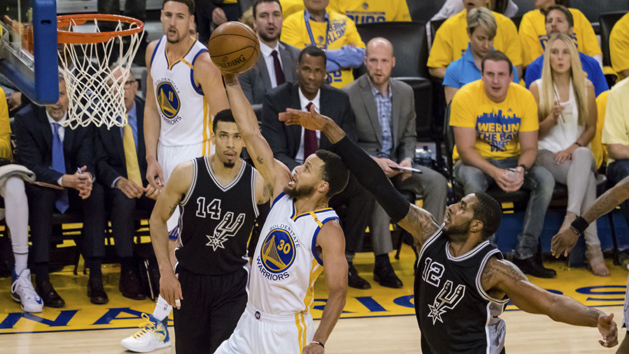 May 16, 2017; Oakland, CA, USA; Golden State Warriors guard Stephen Curry (30) scores ahead of San Antonio Spurs forward LaMarcus Aldridge (12) during the third quarter in game two of the Western conference finals of the NBA Playoffs at Oracle Arena. Photo Credit: Kelley L Cox-USA TODAY Sports