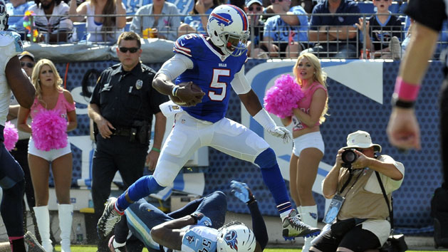 Oct 11, 2015; Nashville, TN, USA; Buffalo Bills quarterback Tyrod Taylor (5) leaps over Tennessee Titans inside linebacker Avery Williamson (54) to score a touchdown during the second half at Nissan Stadium. Buffalo won 14-13. Mandatory Credit: Jim Brown-USA TODAY Sports